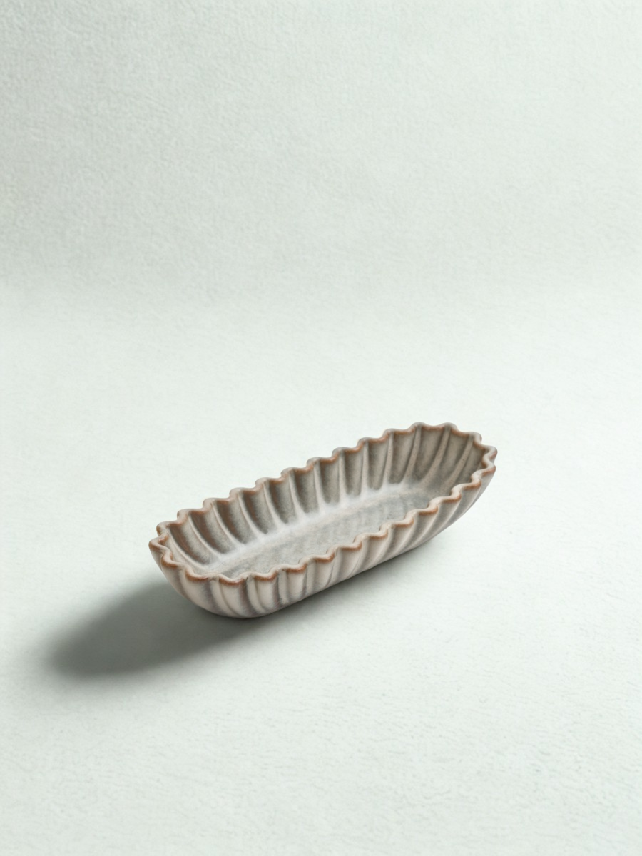 Small oval tray in grooved ceramic – Dark brown